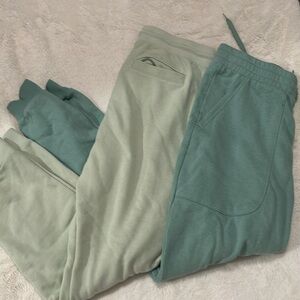 Green and light green sweat pants